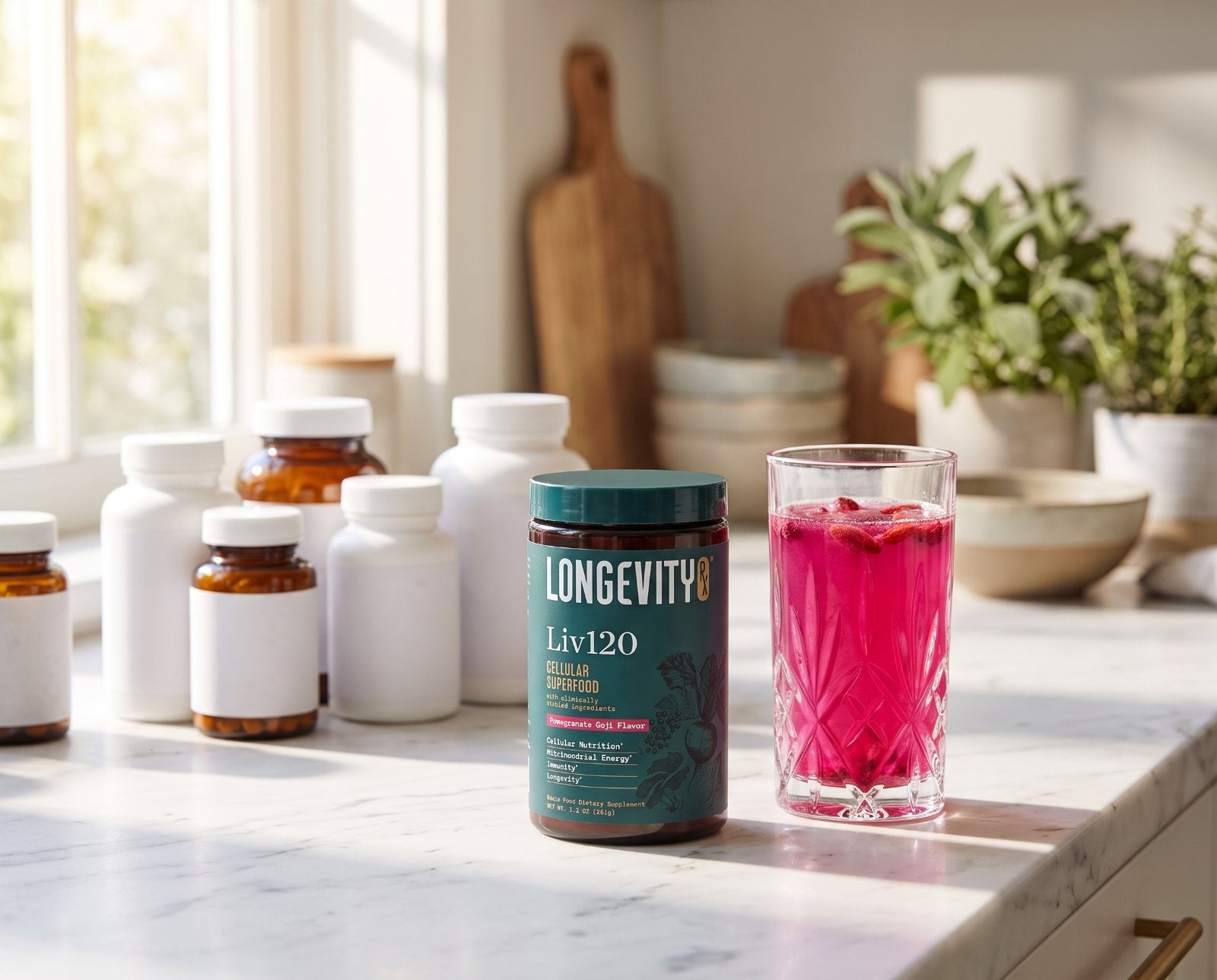 A Liv120 jar and a glass of pink Liv120 drink on a kitchen counter in front of a row of supplement bottles